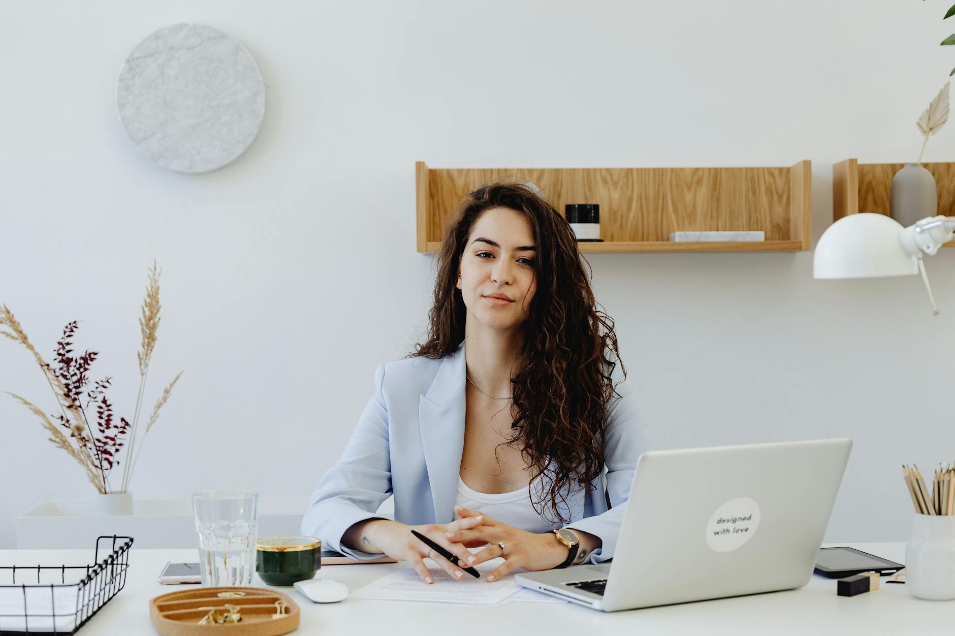 a businesswoman sitting behind her desk